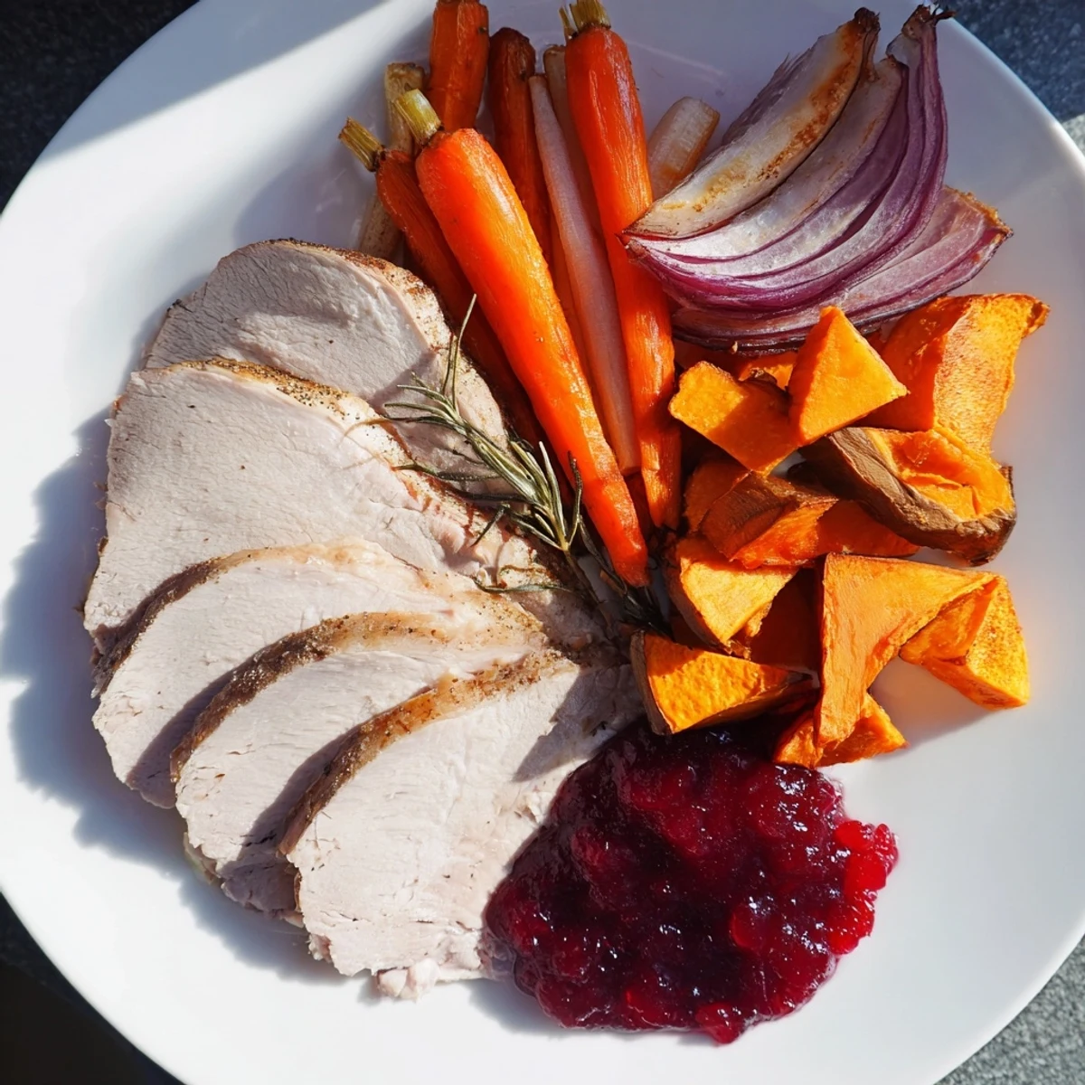 Juicy slices of Harvest Turkey Platter alongside colorful roasted root vegetables, ready to serve this autumn.