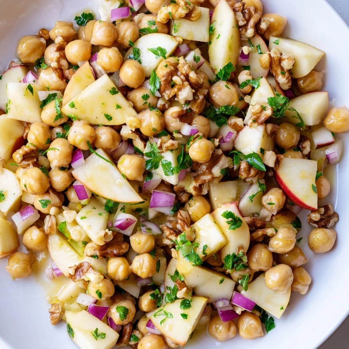 Close-up of Fall Harvest Apple and Chickpea Salad with honey-mustard dressing, it is a perfect side dish.