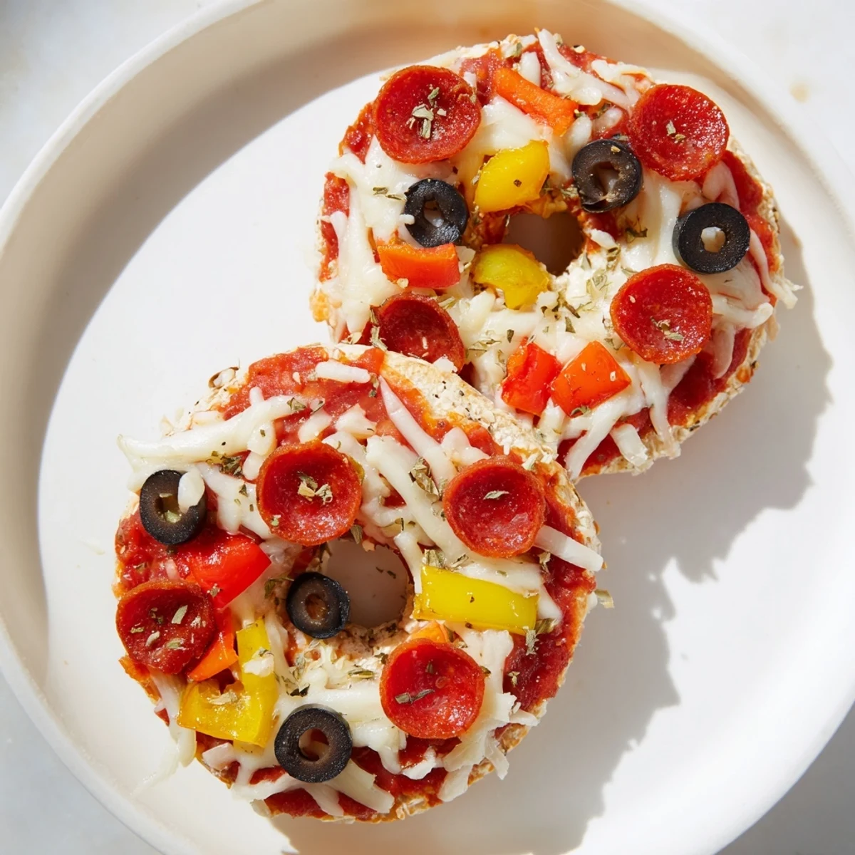 Air-fried mini bagel pizzas: Cheesy, flavorful bites with customizable toppings for everyone.