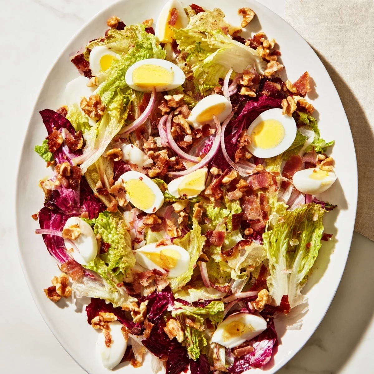 Hearty Bitter Greens Salad with Warm Bacon Dressing, featuring wilted greens with crispy bacon.