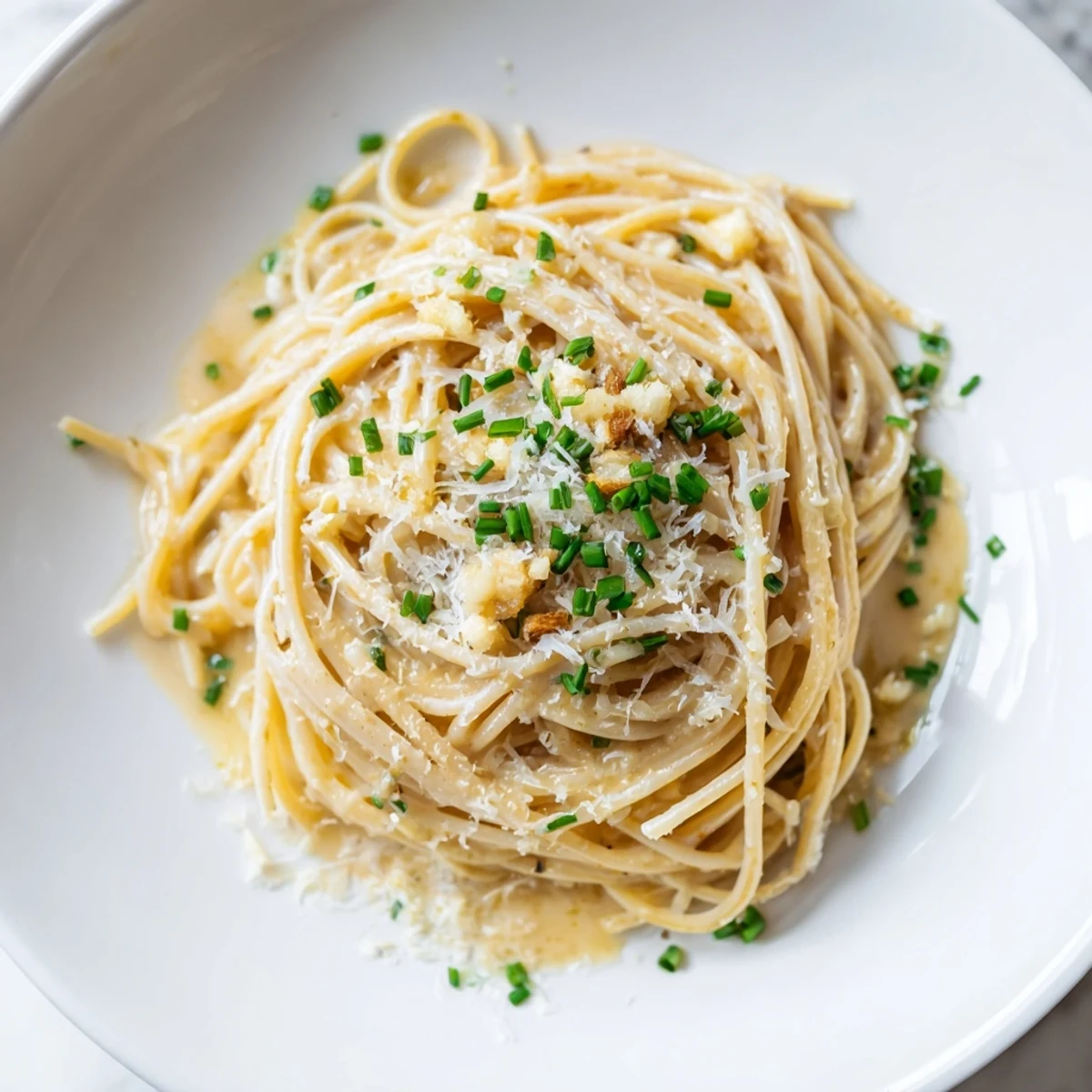 Creamy Miso Butter Pasta, glistening with Parmesan, ready for a comforting bite.