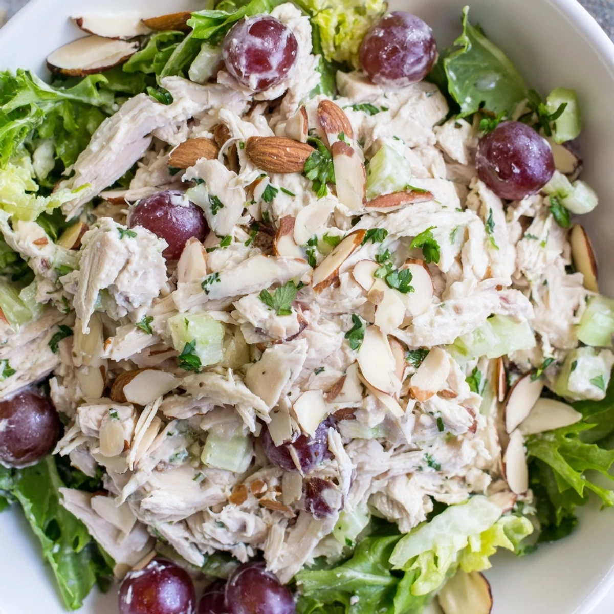 Savory Crispy Chicken Salad with juicy grapes, ready to enjoy on fresh salad greens.