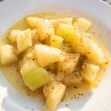 Warm, close-up shot of slow cooker stewed apples, a delightful dessert or topping, ready to serve.