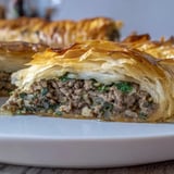 A close-up of a freshly baked Bosnian Burek, showcasing its crispy, golden layers.