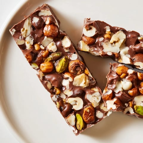 Delightful close-up of Nutty Nougat Snack Bars, showcasing their chewy texture and glistening honey.