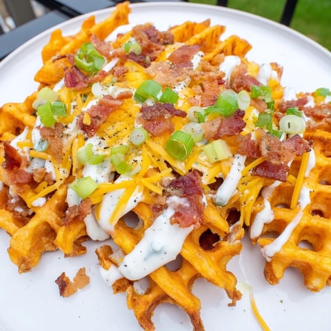 Warm, cheesy Loaded Sweet Potato Fries with crispy bacon, ranch, and green onion topping.