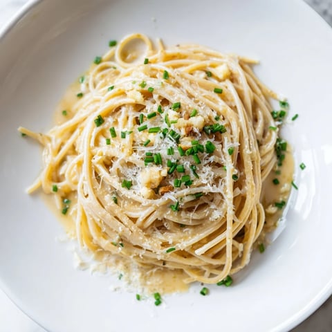 Creamy Miso Butter Pasta, glistening with Parmesan, ready for a comforting bite.