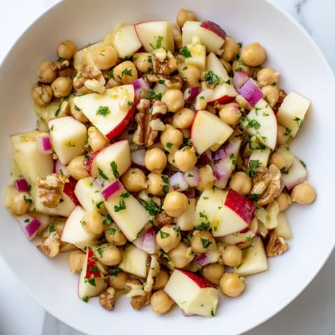 Crisp apples and crunchy walnuts in this Fall Harvest Apple and Chickpea Salad; a fall favorite for sure.