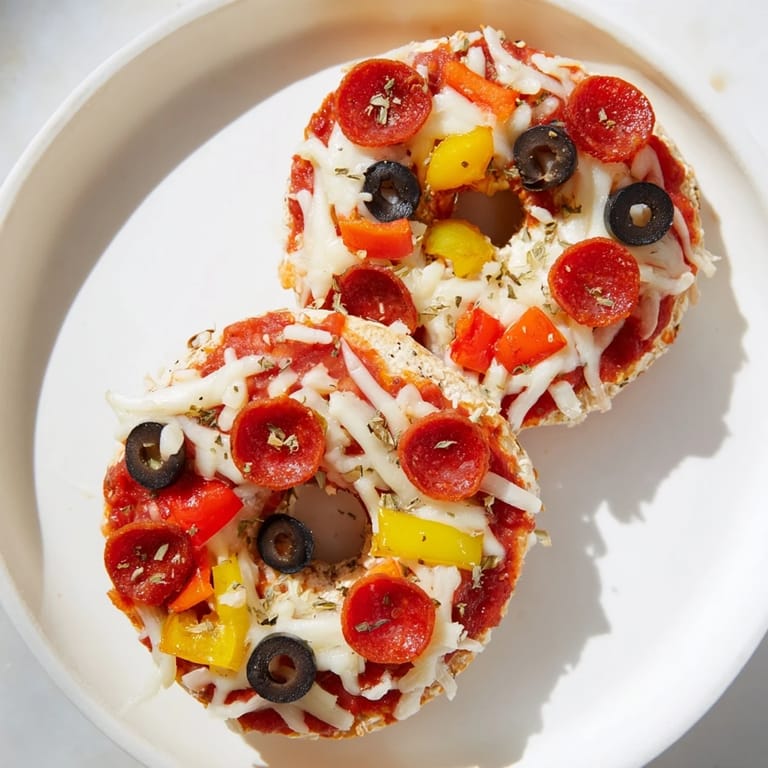 Air-fried mini bagel pizzas: Cheesy, flavorful bites with customizable toppings for everyone.