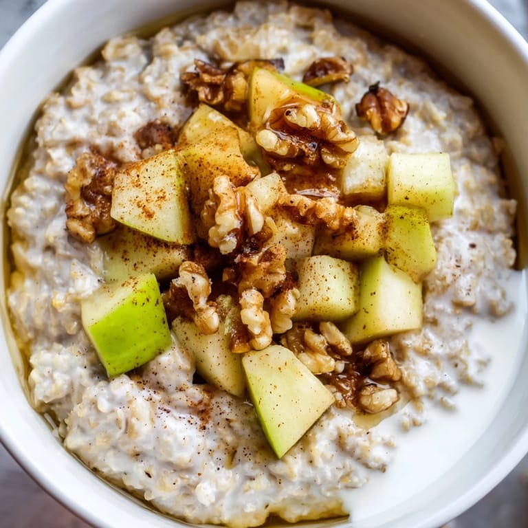 A close-up shot of a cozy apple pie oatmeal bowl, perfect for a comforting breakfast.