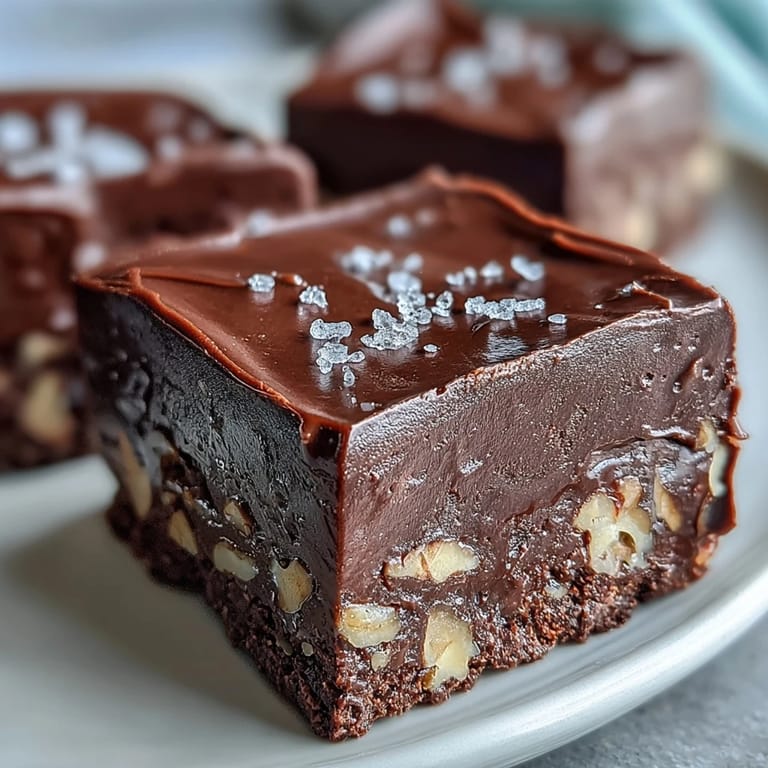 Homemade Hojicha Fudge cut into neat squares, highlighting the dense texture and roasted tea aroma in a soft focus.