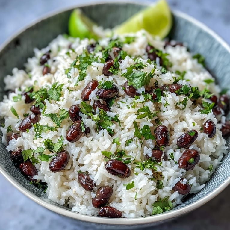 Steamy coconut lime rice, a flavorful side with lime, cilantro, and beans.
